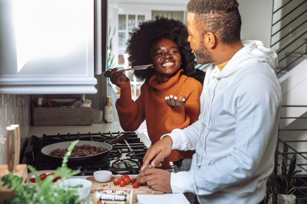Couple cooking in the kitchen, smiling